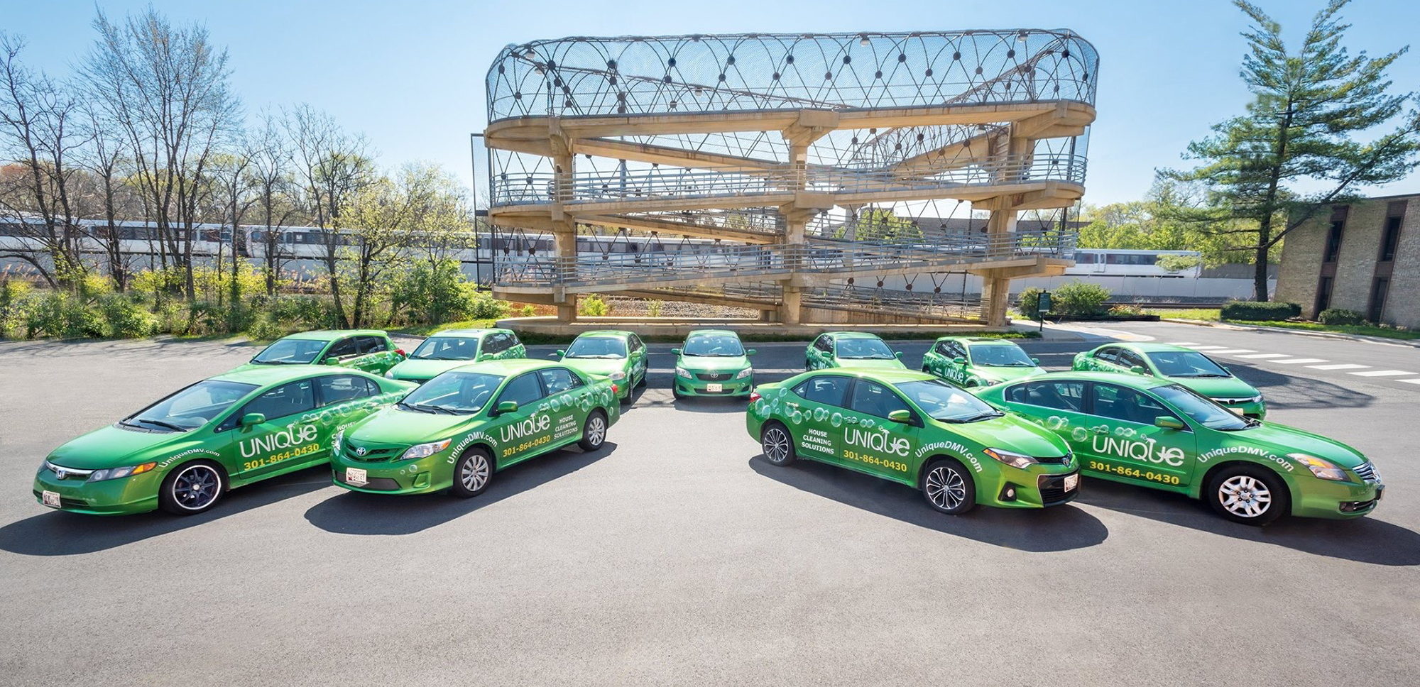 custom vehicle wraps on multiple compact cars for Unique Cleaning services company