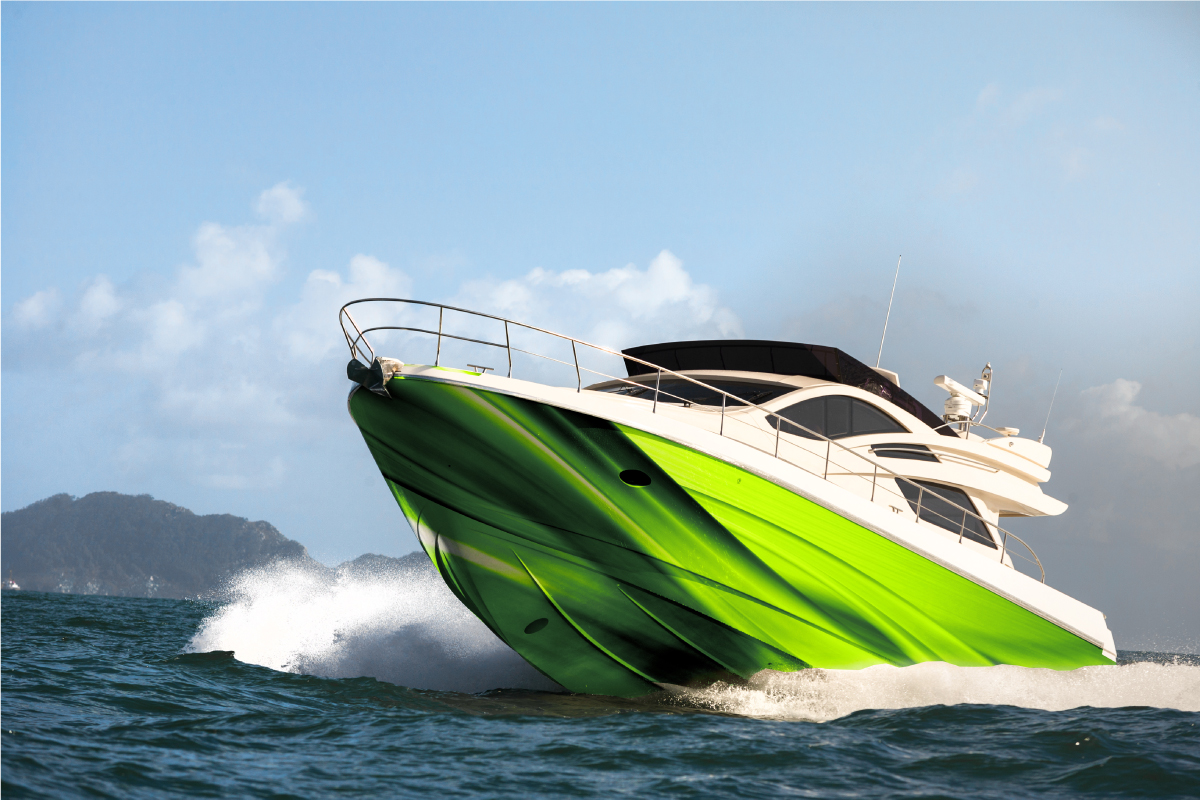 Green and white motorboat on water