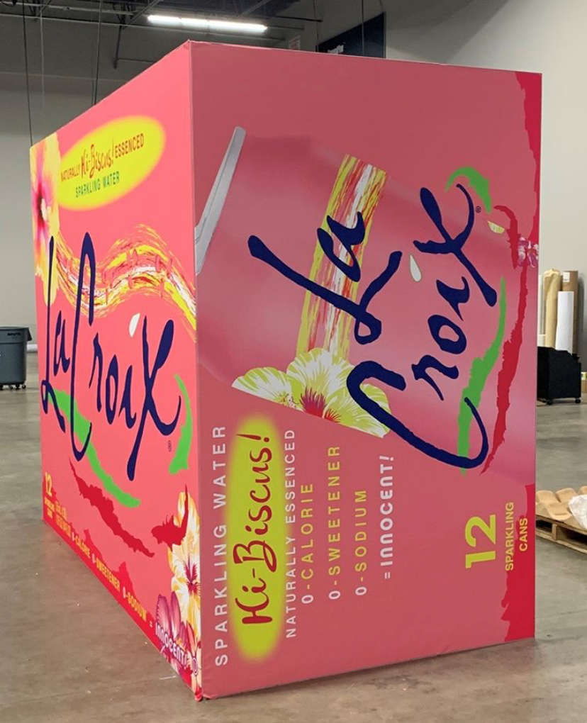 Pink box with blue text, large and visually striking design