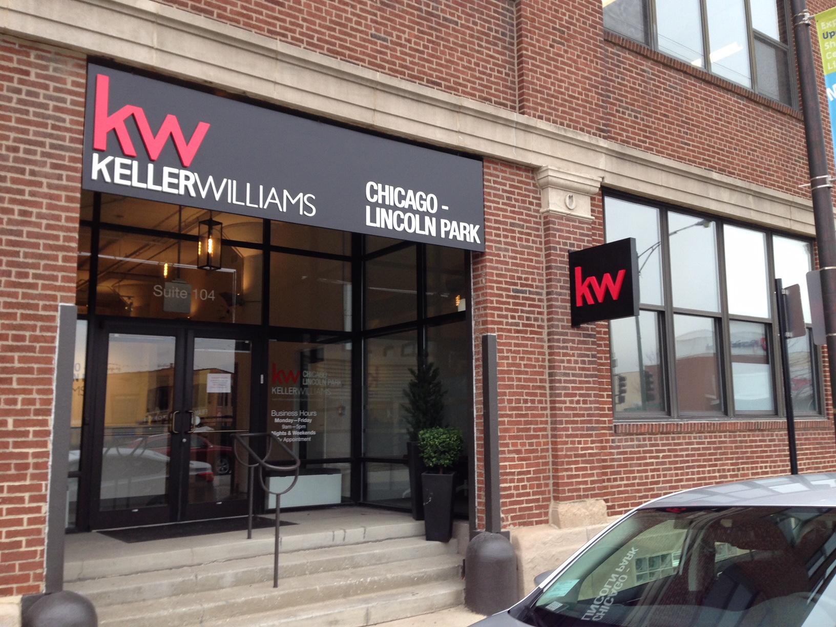 Keller Williams outdoor sign over storefront. 
