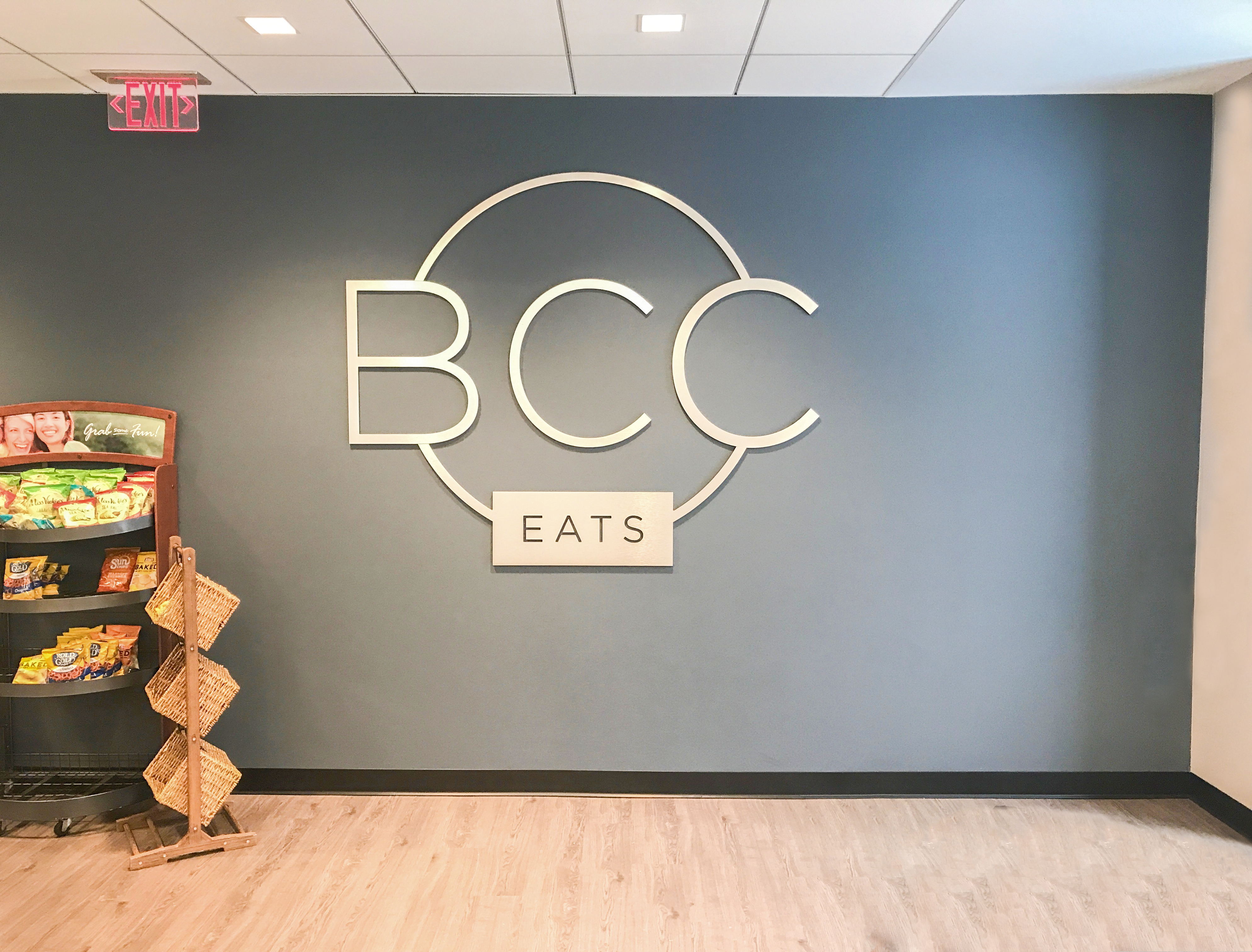 BCC Eats logo signage in store. 