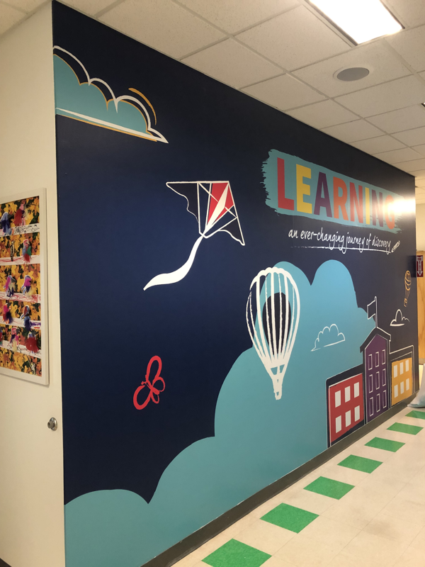 School wall graphic encouraging learning. 