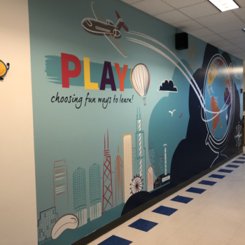 School wall graphic encouraging play.