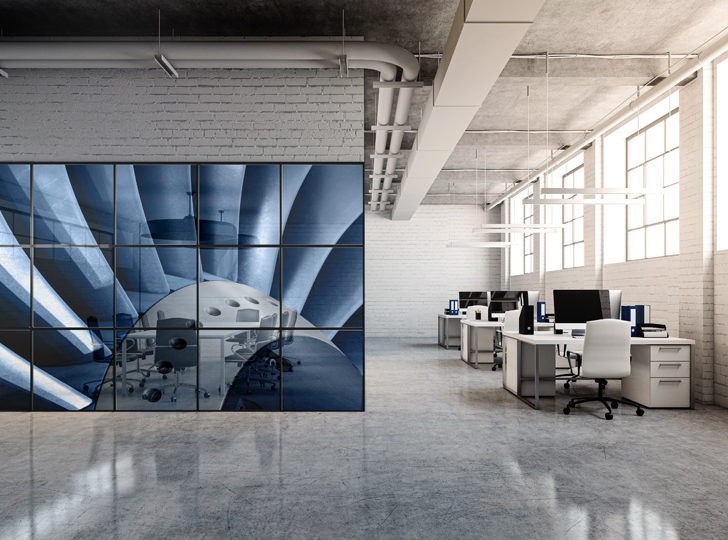 Blue and white decal of office chairs at a table on a wall in an office.